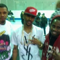 three men posing for a picture in a gym